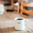 A coffee mug with the word 'Begin' on it